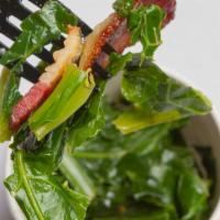 Collard Greens · Seasoned collard greens with halal bacon.