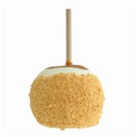 Cheesecake Apple · Caramel-covered granny smith apple dipped in white confection, rolled in crushed graham crac...