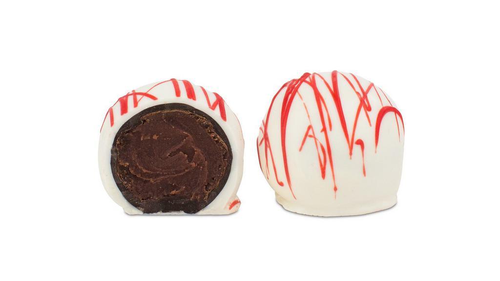 Red Velvet Truffle · It's A creamy ganache center made with our gourmet milk chocolate and delicious red velvet flavoring. Encased in A shell of our sweetest white confection and decorated with red confection. Be still my heart!.