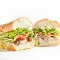 Turkey Club · Turkey breast with bacon & Swiss cheese on a French baguette. Includes mayo, tomato & lettuce.