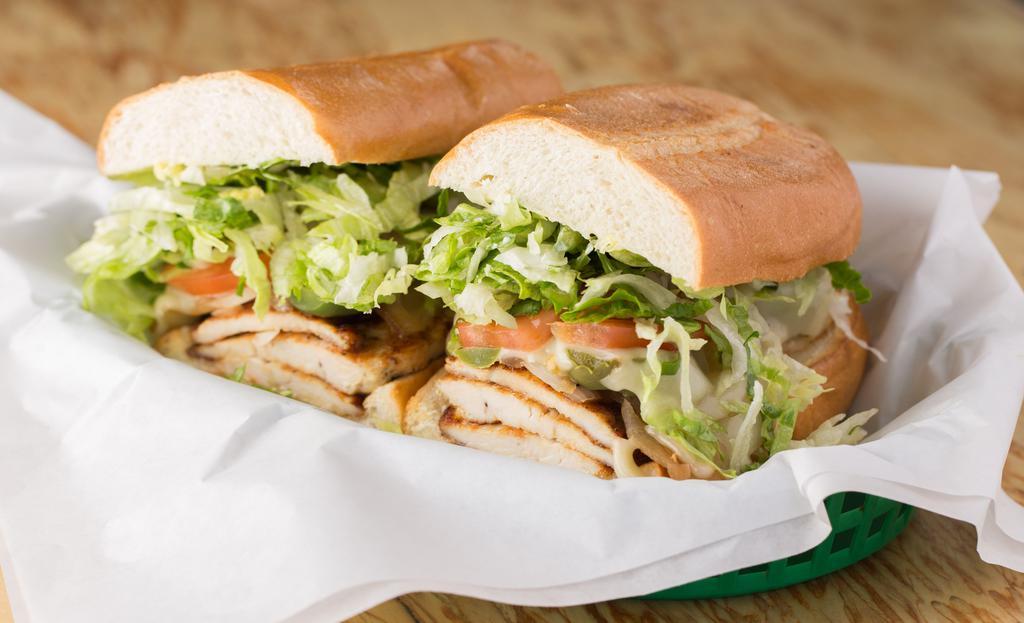 Baja Chicken · Marinated chicken breast, grilled onions, jalapeño peppers and melted jack cheese on a toasted French baguette. Includes mayo, tomato and lettuce.