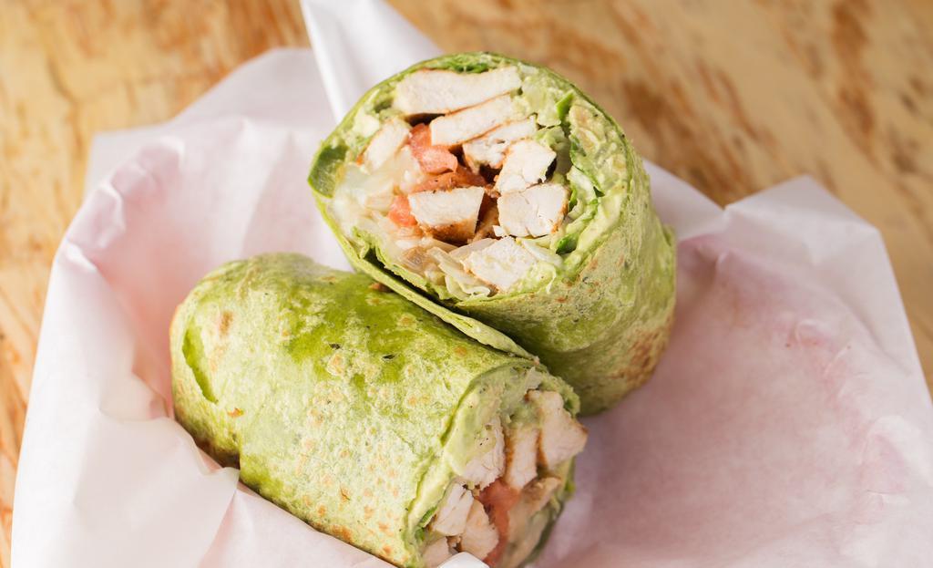 Baja Wrap · Marinated chicken breast, avocado, grilled onions, jalapeño peppers and melted jack cheese with tomato and lettuce served in a spinach wrap.