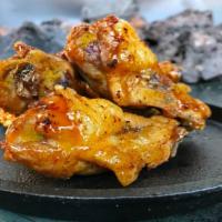 8 Bone-In Wings  · 8 pc Bone-In wings tossed with up to 2 flavors.