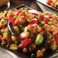 Kung Pao Chicken · Spicy. Diced chicken meat with peanuts, onions, dry chili peppers, and zucchini in our tradi...