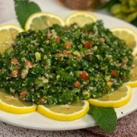 Tabouleh · Vegetarian. Chopped parsley, onions, tomatoes, cucumbers, mint, green onions & cracked wheat...