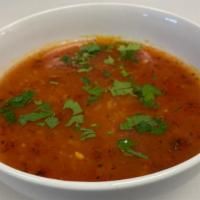 Tomato Soup · Vegetarian. Fresh ripe tomatoes cooked with rice & spices, topped with mint & garlic.