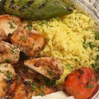 Chicken Shish Kabob · Marinated chicken breast in house spices & grilled over open fire.