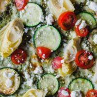 Fresh Green Pie · Basil pesto sauce, mozzarella, feta, roasted eggplant, roasted zucchini, artichoke hearts an...