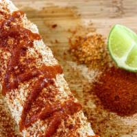 Traditional Mexican Corn On The Cob · Comes with lime, mayonnaise, cotija cheese, tajin and hot sauce!