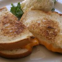 Grilled Cheese · Choice of bread with American cheese or sharp cheddar.