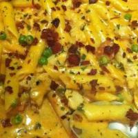 Chicken Carbonara · Penne pasta with chicken, peas and bacon in a delicious pink sauce