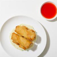 Pork Egg Roll · Two fried egg rolls filled with mixed vegetables and pork and served with house dipping sauce.
