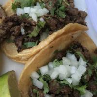 Mexican Street Tacos · Mini Corn Tortilla, Cilantro, Onion & Salsa Verde.