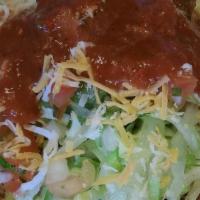 Fiesta Tostada · Crispy Shell, Beans, Lettuce, Fresca, Cheese, Guacamole & Sour Cream