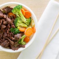 Angus Beef · A serving of Angus beef prepared with Flame Broiler marinade served over rice.