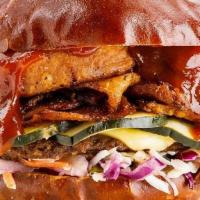 Bbq Brisket Burger · plant-based sliced brisket, signature burger patty, onion  rings, plant-based provolone, Sou...