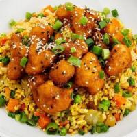 Orange Cauliflower · crispy cauliflower in orange sauce, fried brown rice with carrots, onions, peas, tofu scramb...