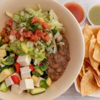 Grilled Veggies & Tofu Bowl · Includes: pinto beans, rice, lettuce, guacamole and pico de gallo served with chips and salsa.