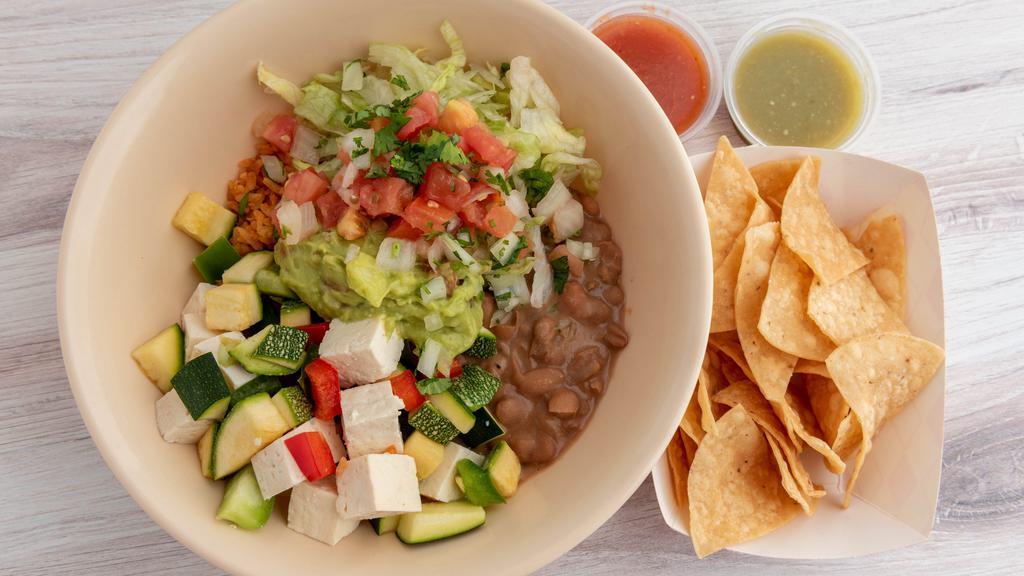 Grilled Veggies & Tofu Bowl · Includes: pinto beans, rice, lettuce, guacamole and pico de gallo served with chips and salsa.