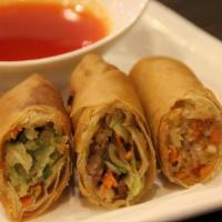 Chicken Eggrolls · Crispy eggrolls with ground chicken, cabbage and carrot filling, served with sweet & sour sa...