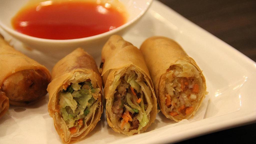 Chicken Eggrolls · Crispy eggrolls with ground chicken, cabbage and carrot filling, served with sweet & sour sauce (4)