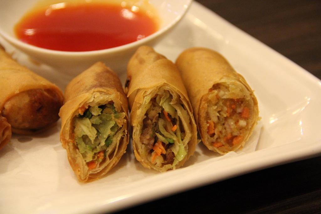 Vegetarian Eggrolls · Crispy eggrolls with cabbage and carrot filling, served with sweet & sour sauce (4)