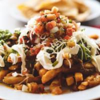 Carne Asada Fries · French fries topped with carne asada, shredded Monterey jack cheese, carne asada, sour cream...
