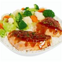 Large Grilled Teriyaki Glazed Salmon · Fresh, grilled salmon, glazed with teriyaki sauce, green onions and sesame seeds. .