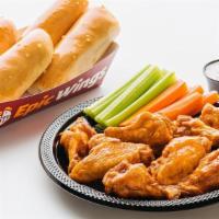 12 Pc Chicken Wings Meal · Includes 12 bone-in wings tossed in your choice of sauce, 4 oven-fresh breadsticks, 12 veggi...
