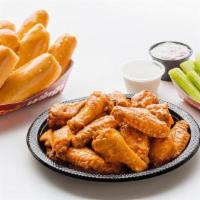 Family 24 Pc Chicken Wings · Includes 24 bone-in wings tossed in your choice of sauce, 8 oven-fresh breadsticks, 16 veggi...