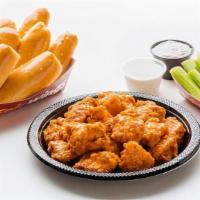 Family 20 Pc Boneless Wings · Includes 20 boneless wings tossed in your choice of sauce, 8 oven-fresh breadsticks, 16 vegg...