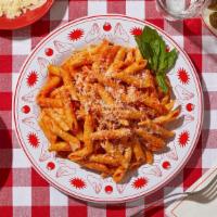 Penne Alla Vodka · Penne pasta tossed in a cremay tomato vodka sauce.