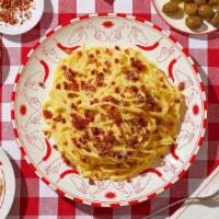 Spaghetti Carbonara · Spaghetti tossed in a carbonara sauce with turkey bacon.