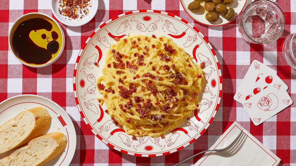 Spaghetti Carbonara · Spaghetti tossed in a carbonara sauce with bacon.