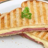 Ham & Swiss · Sliced ham, mushroom, house olive tapenade and melted Swiss cheese all deliciously, served i...