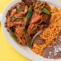 Bistec Ranchero · Carne Asada cooked with jalapenos, onion, and tomatoes to add a delicious spicy flavor.  Inc...