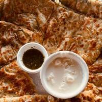 Bolani · Bolani, also called Periki is a stuffed flat-bread from Afghanistan, fried with a filling. I...