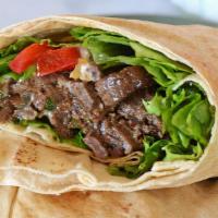 Beef Shawarma Combo  · shredded boneless beef with tortilla bread, salad and tzuzki sauce or green sauce and french...