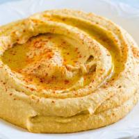 Hummus · Mashed chickpeas blended with olive oil, salt, lemon juice, and garlic.