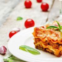 Meat Lasagna · Layers of lasagna shell pasta, topped with juicy beef, parmesan, mozzarella and ricotta and ...