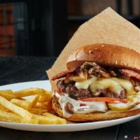 Burger Melt · 1/2 lb of juicy beef grilled to perfection, served with grilled onions and melted cheese. Co...