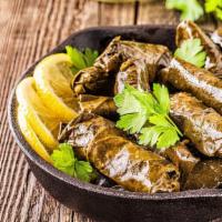 Dolma · Grape leaves stuffed with rice, and house-blended herbs, lemon juice.