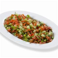 Coban Salata · Tomatoes, cucumbers, onions, fresh parsley with house vinaigrette.