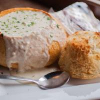 Clam Chowder · Hot and creamy new england style chowder with chunks of potatoes and clams served in a toast...