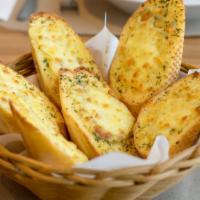 Garlic Bread · Delicious warm bread topped with herb seasoning and fresh garlic.