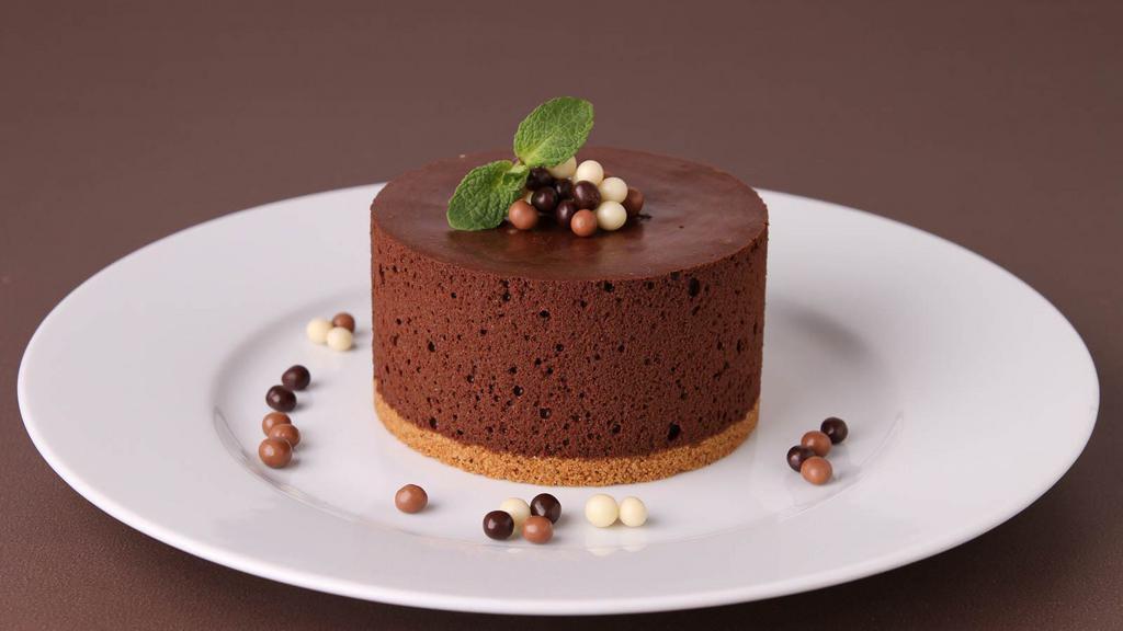 Chocolate Mousse Cake · Slice of moist chocolate cake with a layer of chocolate mousse.