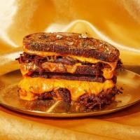 Blinged Out Brisket Grilled Cheese · This umami packed grilled cheese with knock your socks off! Tender brisket with caramelized ...