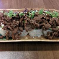 Bulgogi Roll · CA roll topped w/ Korean BBQ bulgogi, sesame seeds & eel sauce.