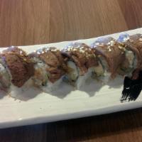 Surf & Turf Roll · Shrimp tempura, avocado, imitation crab & cucumber roll topped w/ seared ribeye beef, minced...