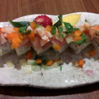 Sancho  Roll · Spicy tuna, imitation crab, avocado & cucumber roll topped w/ yellowtail & lime shrimp cevic...